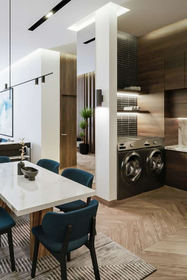 hardwood installed in herringbone pattern in open concept home with laundry nook